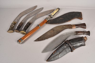 Lot 711 - A group of five Kukri knives