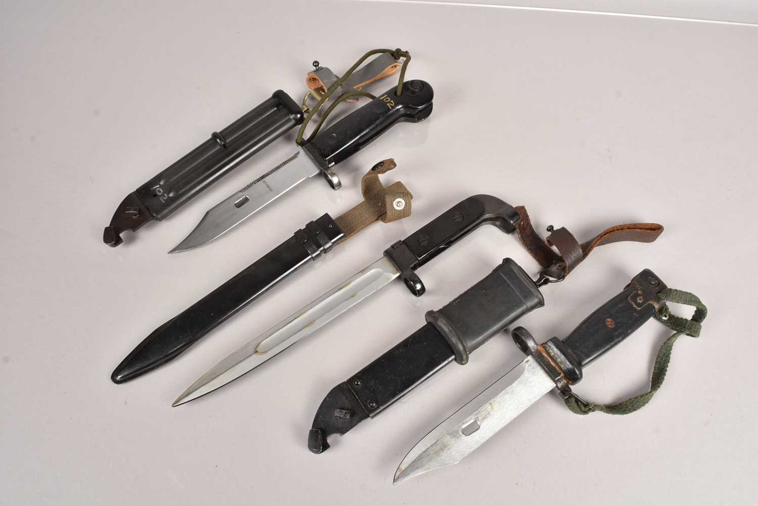 Lot 757 - Three AK47 bayonets and scabbards