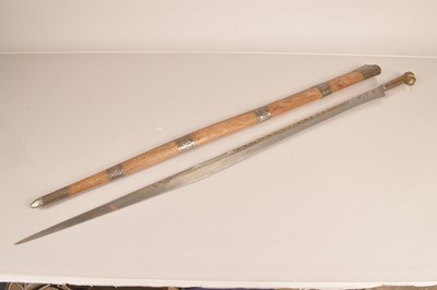 Lot 790 - A North African Flyssa sword