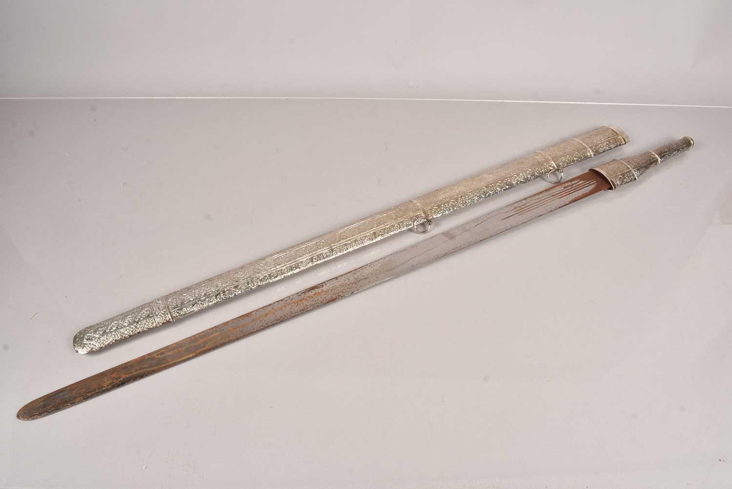 Lot 792 - A late 19th Century/ early 20th Century Omani Kattara sword