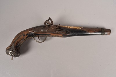 Lot 807 - A Middle Eastern decorated flintlock pistol