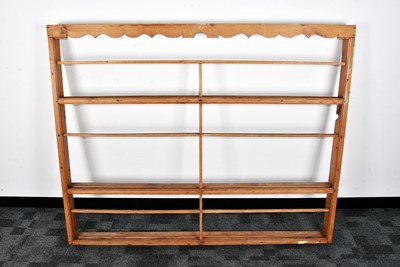 Lot 69 - A 19th century pine wall mounted plate rack