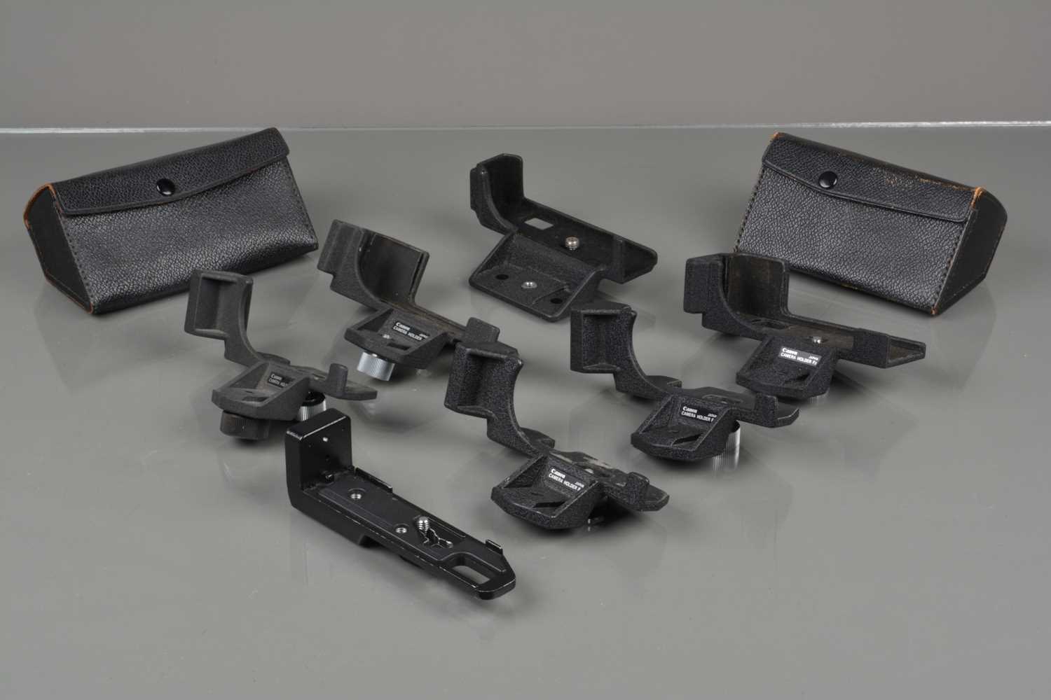 Lot 68 - A Group of Canon Camera Holders