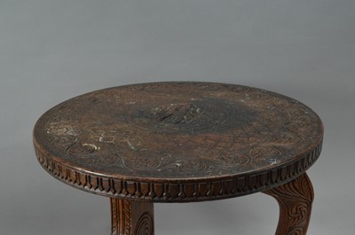 Lot 89 - A small carved hardwood Indian tripod table
