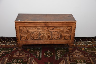 Lot 19 - A Boer War period carved wooden chest