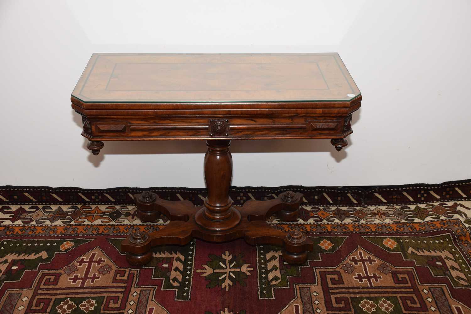 Lot 28 - A Victorian walnut and ebony inlaid card table