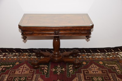 Lot 28 - A Victorian walnut and ebony inlaid card table