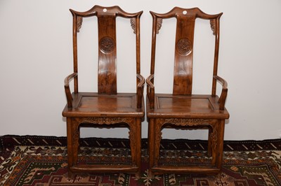 Lot 31 - A pair of Chinese hardwood marriage armchairs