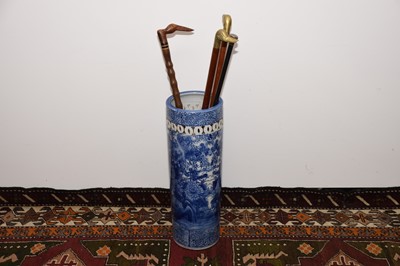 Lot 34 - An early 20th century Japanese Arita style porcelain stick stand with four sticks and canes