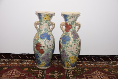 Lot 36 - A pair of heavily restored c1920s Japanese earthenware vases