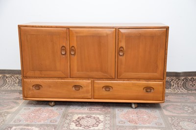 Lot 64 - A 1960s light wood sideboard by Ercol