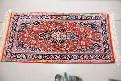 Lot 106 - An oriental Kashan hand-knotted wool rug