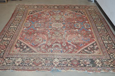 Lot 117 - A large antique hand-knotted wool Heriz carpet