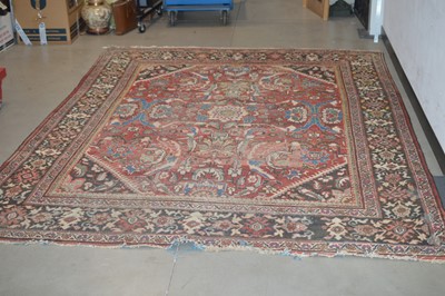 Lot 117 - A large antique hand-knotted wool Heriz carpet