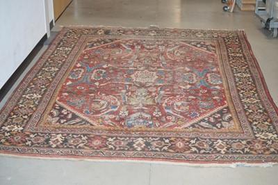 Lot 117 - A large antique hand-knotted wool Heriz carpet