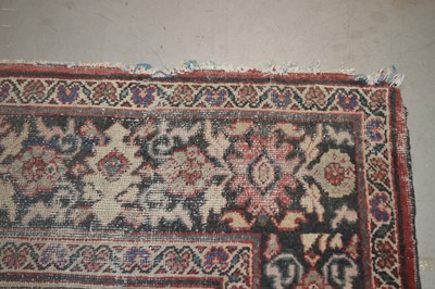 Lot 117 - A large antique hand-knotted wool Heriz carpet