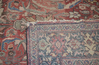 Lot 117 - A large antique hand-knotted wool Heriz carpet