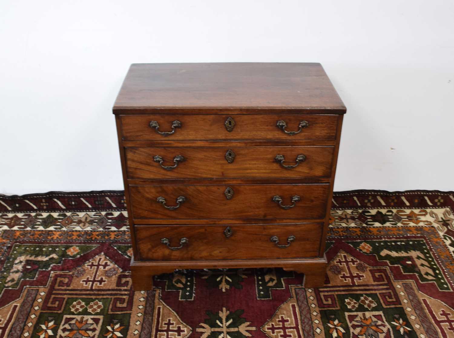 Lot 122 - A George III small mahogany tea caddy chest of drawers