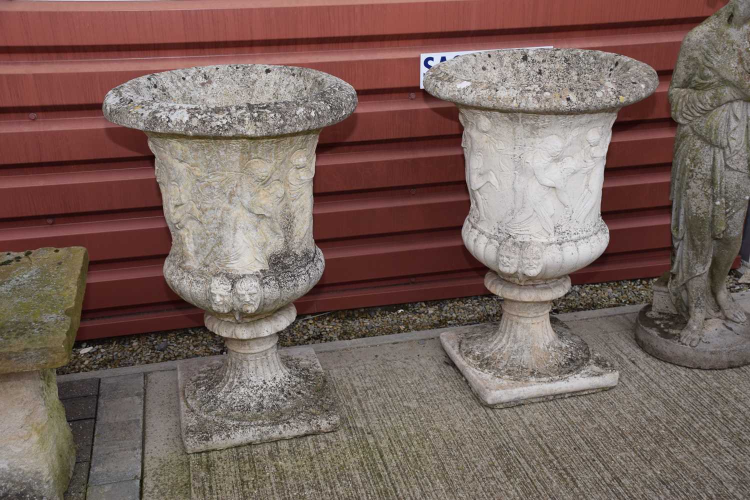 Lot 131 - A pair of second half 20th century concrete garden urns