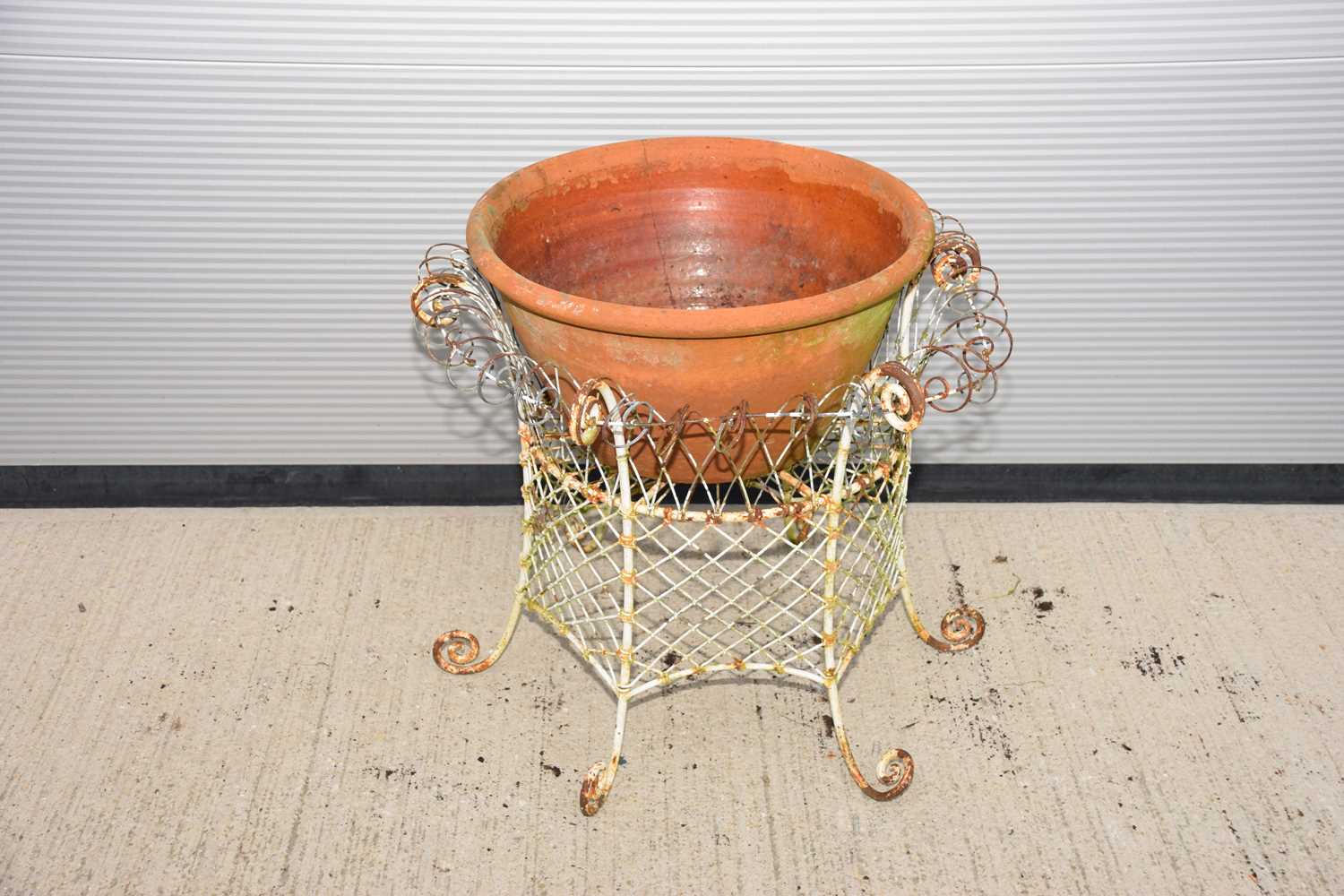 Lot 141 - A second half 20th century white painted metal mesh garden plant pot support