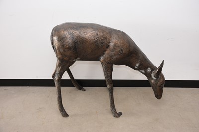 Lot 143 - A modern bronzed metal garden sculpture of a deer, AF, 84cm high and 114cm long
