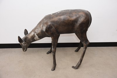 Lot 143 - A modern bronzed metal garden sculpture of a deer, AF, 84cm high and 114cm long