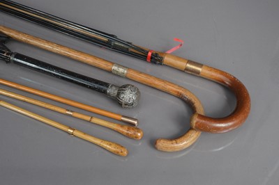 Lot 176 - Two parasols and a walking and three riding crops
