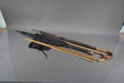 Lot 176 - Two parasols and a walking and three riding crops