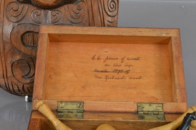 Lot 193 - A 19th Century New Zealand woods treen box and a later vintage carved Koruru Mask