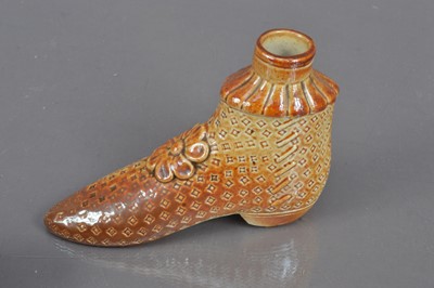 Lot 201 - A group of three 19th Century salt glazed treacleware shoe shape items