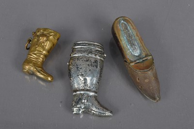 Lot 208 - Three boot shaped vesta cases