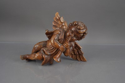 Lot 226 - A circa Mid 20th Century carved wooden cherub or putti