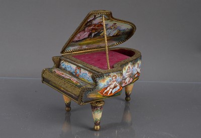Lot 258 - A Viennese enamelled gilt metal miniature piano shape music box