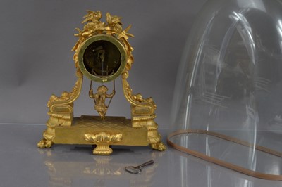 Lot 259 - A French late 19th Century gilt bronze ormolu cherub swing pendulum mantel clock