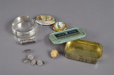 Lot 279 - A silver bracelet and a tin containing various silver items etc