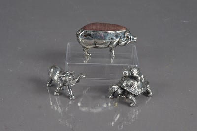 Lot 280 - A silver pig pin cushion (Birmingham 1913) commemorating "Survetta House St Moritz"