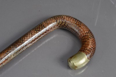 Lot 294 - An unusual snakeskin leather covered walking stick