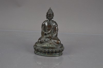 Lot 315 - A small bronze sculpture of the seated Buddha