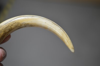 Lot 316 - A Japanese carved boar's tusk