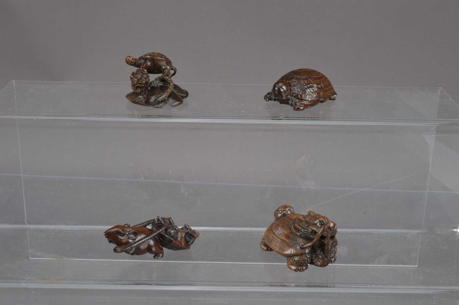 Lot 318 - Four Japanese carved wood netsuke