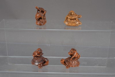 Lot 319 - Four Japanese carved wood netsuke