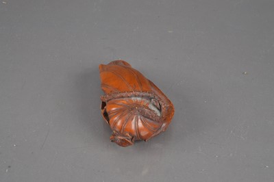 Lot 320 - A Japanese boxwood carving of a lotus leaf