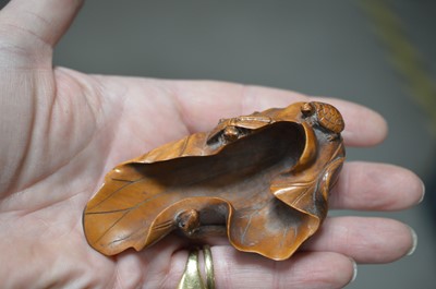 Lot 320 - A Japanese boxwood carving of a lotus leaf