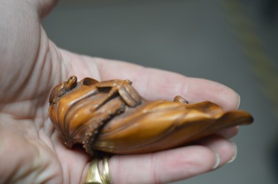 Lot 320 - A Japanese boxwood carving of a lotus leaf