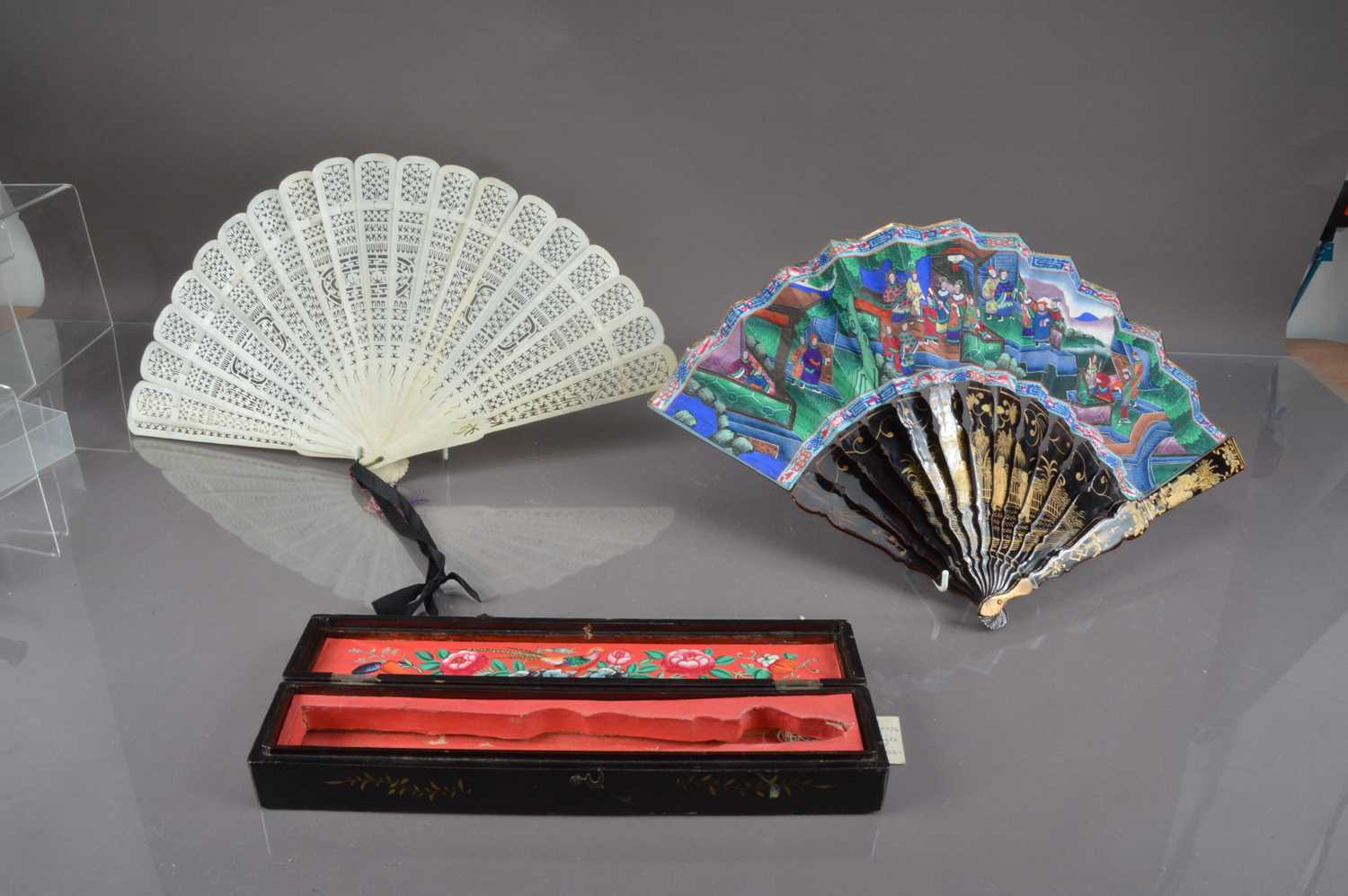 Lot 322 - A Chinese export black lacquer 19th Century hand-painted fan