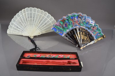 Lot 322 - A Chinese export black lacquer 19th Century hand-painted fan