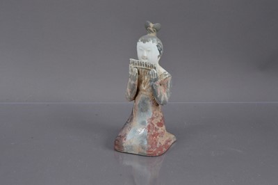 Lot 338 - A Chinese Tang Dynasty style polychrome painted terracotta figure of a kneeling court musician