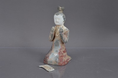 Lot 338 - A Chinese Tang Dynasty style polychrome painted terracotta figure of a kneeling court musician