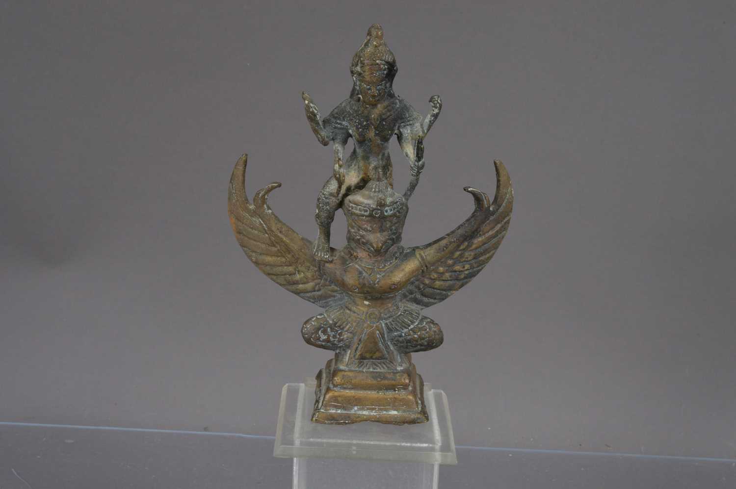 Lot 339 - A small bronze Hindu statue of the god Vishnu riding on Garuda