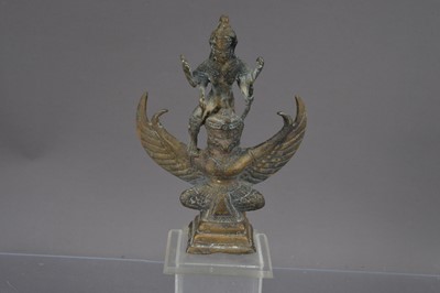 Lot 339 - A small bronze Hindu statue of the god Vishnu riding on Garuda
